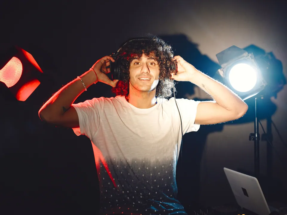 Musician working with headphones in a studio